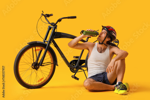 Young male cyclist with bic...