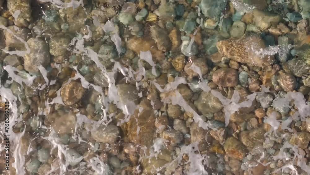 Waves Crashing On Pebbles And Rocks On The Praia Brana de Lazo In Camariñas, A Coruña, Spain. - overhead shot