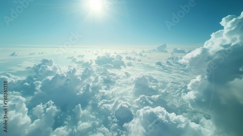 Aerial view of clouds with sun glare from above - The image offers a stunning spectacle of the sun s glare piercing through a dense cloud cover  symbolizing hope and new beginnings