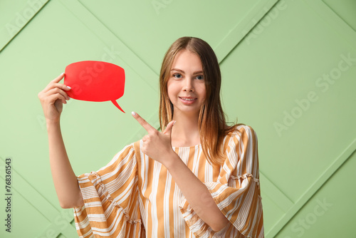 Pretty young woman pointing...