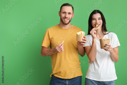 Beautiful young couple eati...