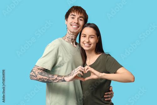Young couple holding hands ...