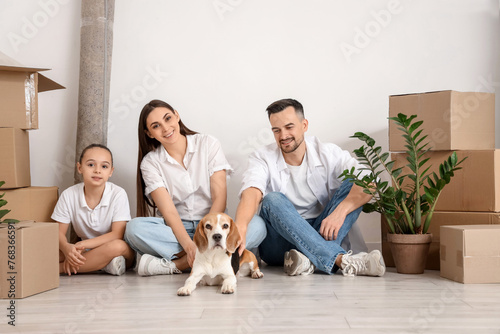 Happy family with dog sitti...