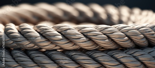 A macro photography shot showcasing the intricate pattern of a rope against a black background. The natural material and texture of the rope creates a visually captivating image