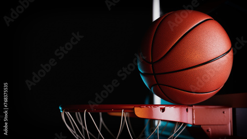 The basketball ball is passing through the hoop.