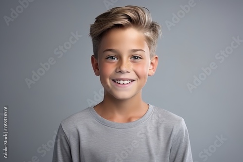 Portrait of a cute little boy in grey t-shirt.