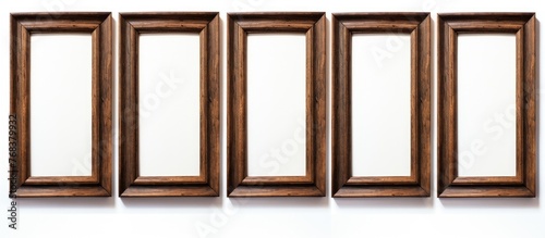 Displaying a collection of four rectangular wooden frames positioned against a clean white backdrop for showcasing art or photos photo