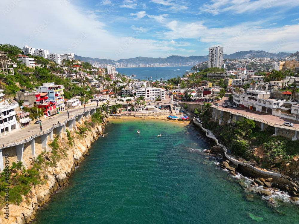 Fototapeta premium Drone Photo of La Angosta Beach in Acapulco, Tranquil Seaside Area and clouds