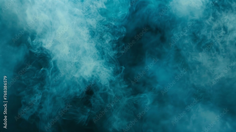 Ethereal blue smoke swirling against a dark backdrop, ideal for creative concepts and backgrounds.