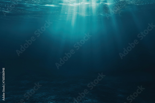 Mysterious Deep Ocean Scene Illuminated by Sunlight Beams photo