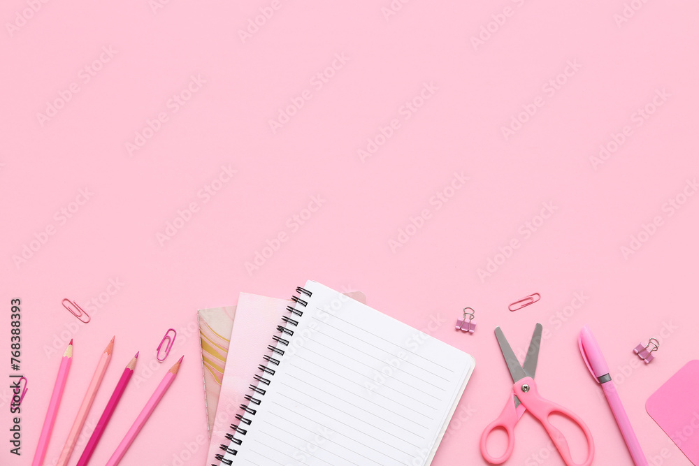 Notebook, pencils and scissors on pink background. Top view Notebook, pencils and scissors on pink background. Top view