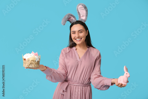 Smiling woman in bunny ears...