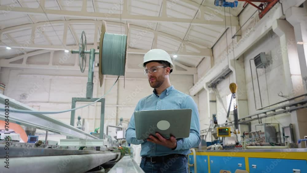 Chief Engineer With Laptop On Factory Analyzes The Production Process Chief Engineer With Laptop On Factory Analyzes The Production Process