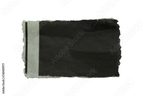 Torn black newspaper