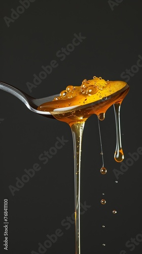 A spoonful of whipped honey, light and airy, with tiny air bubbles visible within the dripping liquid