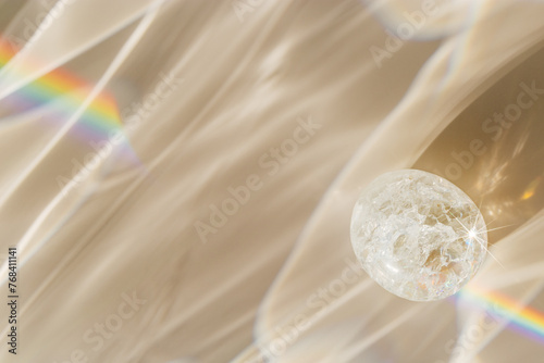 Quartz Prism's Rainbow Reflection at sunlight, close up of clear quartz crystal captures prismatic rainbow, natural facets and beauty of mineral. Minimal aesthetic nature pattern, beige pastel tone