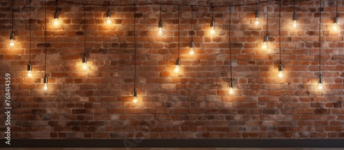 A brown brick wall adorned with strings of amber lights, creating a warm and inviting atmosphere. The symmetrical pattern of the lights contrasts beautifully with the wood flooring