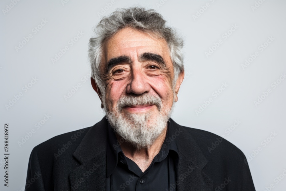 Portrait of an old man with grey hair and beard in black shirt Portrait of an old man with grey hair and beard in black shirt