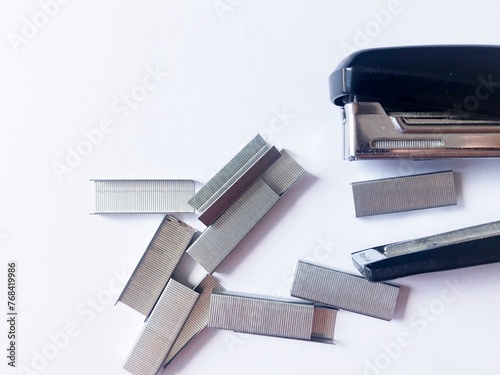 Wallpaper Mural Stapler, hand and box of staples on white background. Torontodigital.ca