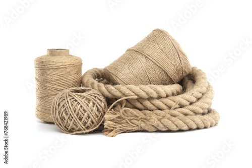 Rolls of natural jute rope and twine isolated on white
