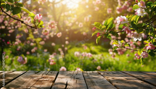 Here is the image visualizing a serene park during spring with blossoming flowers and a lush garden, alongside a wooden fence covered in autumn leaves The setting captures the dual beauty of nature, f photo