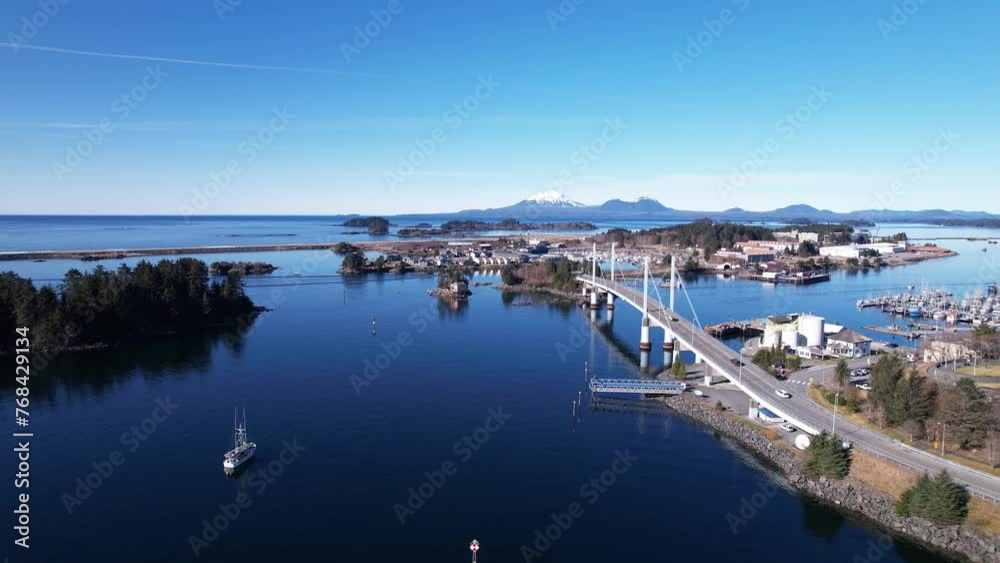 4k 23.98fps aerial video of beautiful Sitka, Alaska. Pacific Ocean winds through mountainous islands. John O'Connell bridge in the foreground and Mount Edgecumbe in the background. March of 2024. 4k 23.98fps aerial video of beautiful Sitka, Alaska. Pacific Ocean winds through mountainous islands. John O'Connell bridge in the foreground and Mount Edgecumbe in the background. March of 2024.