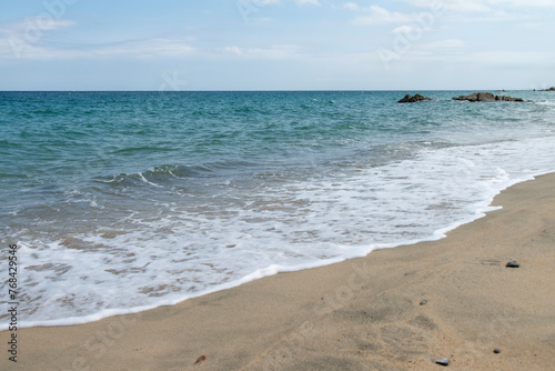 Seascape at the sand beach photo