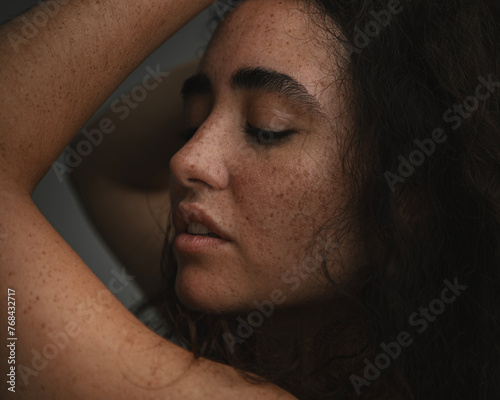 Candid portrait of a freckled woman