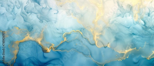   A close-up image of vivid blue and yellow fluid paint with an intricate gold swirl at the base