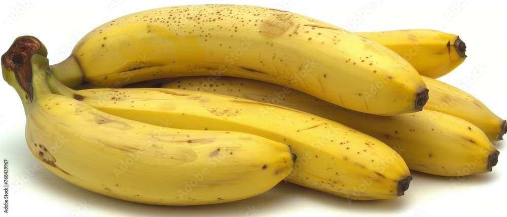 A group of overripe bananas are arranged on a white background, displaying a visible brown spot on top A group of overripe bananas are arranged on a white background, displaying a visible brown spot on top