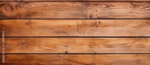 A closeup shot of a brown hardwood flooring plank with a grainy texture showing the natural pattern of the wood grain