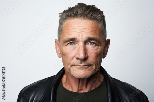 Portrait of a senior man in a leather jacket looking at the camera © Chacmool