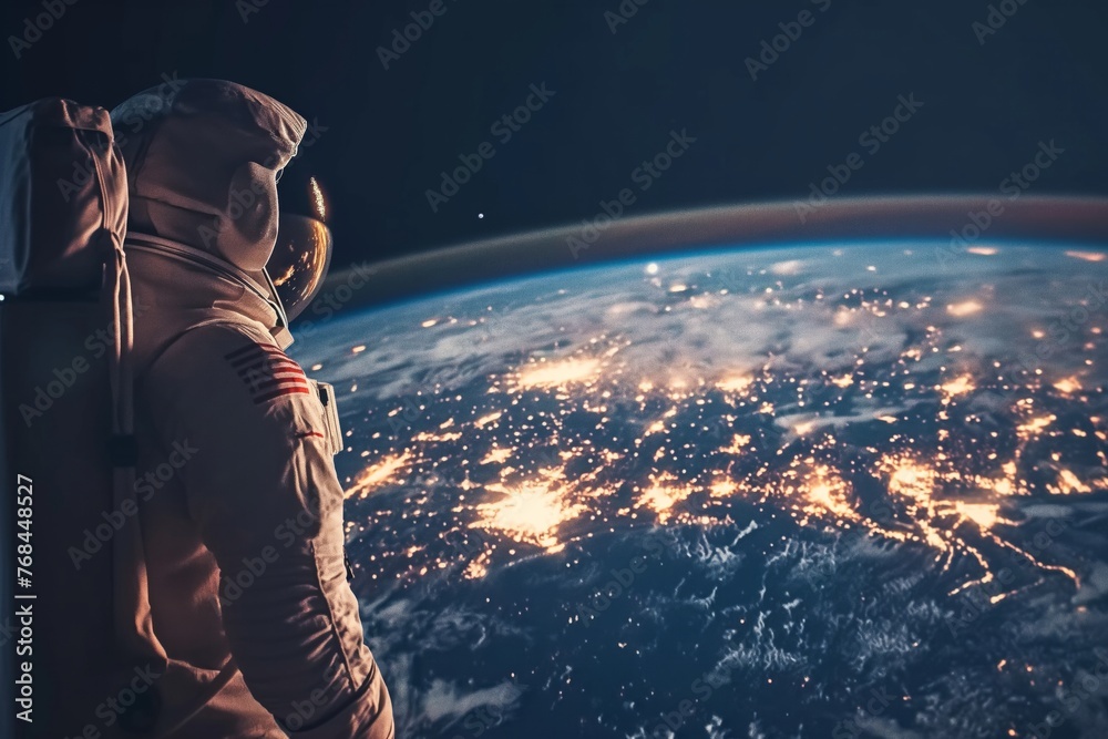 An astronaut in space looks at the earth, copy space for text. Science and technology concept. Cosmonautics Day, National Astronaut Day.  - obrazy, fototapety, plakaty 