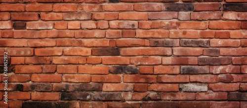 Detailed view of a brick wall showing numerous individual stone blocks of varying sizes and shades