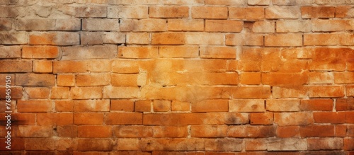 A close up of a brown brick wall with amber and orange tinted shades. The rectangular brickwork creates a beautiful pattern, resembling wood building material