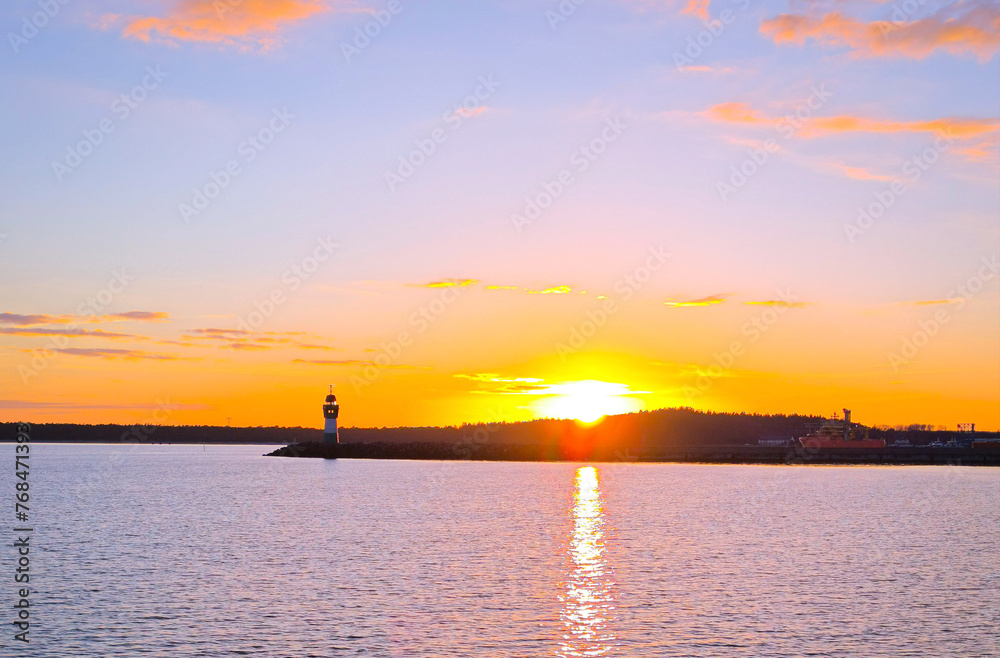 Lighthouse and sunset in Mukran port