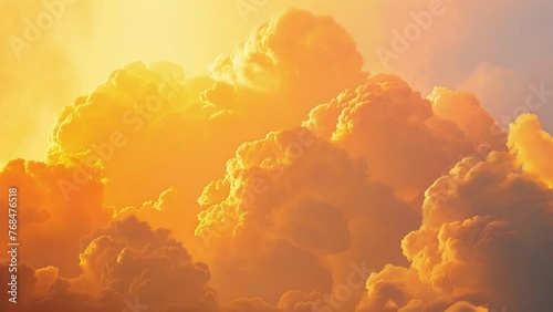 Majestic clouds backlit by the morning sun radiating in shades of pink orange and yellow. photo
