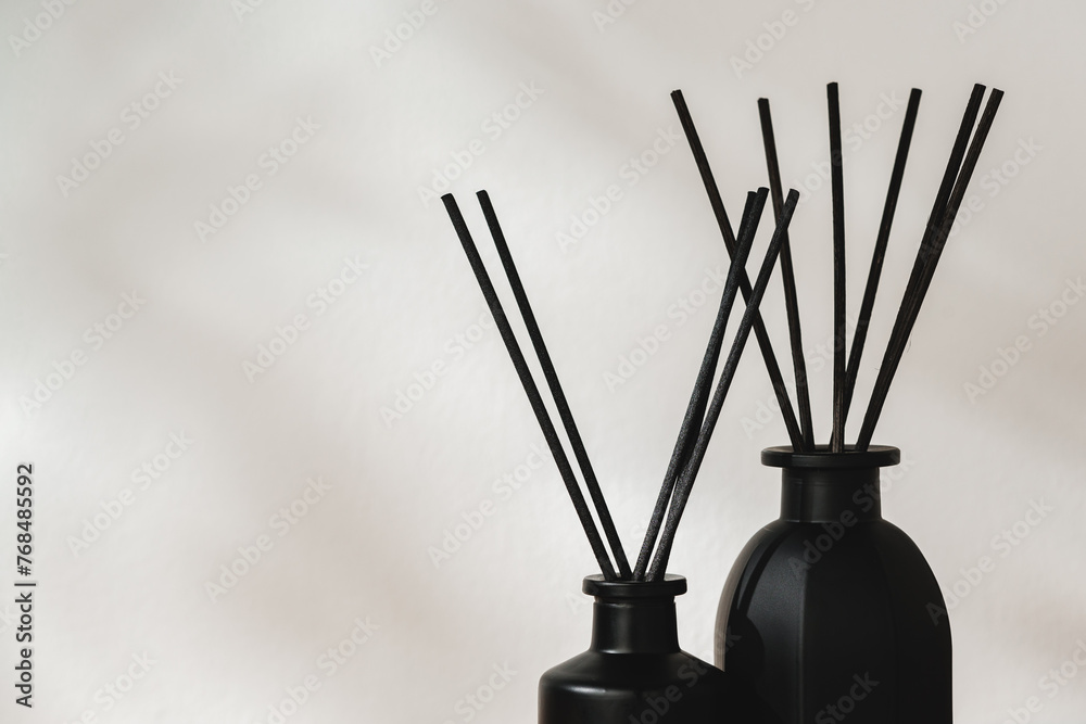 Minimalist Aromatic Reed Diffusers on a Wooden Surface Against a Soft Background - obrazy, fototapety, plakaty 