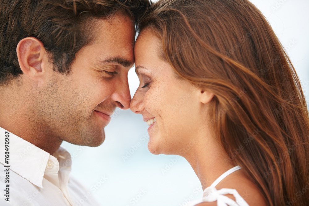 Happy couple, nose touch and love by ocean for commitment and travel on honeymoon in sunshine. Man, woman and face together for bonding in marriage, leisure and satisfaction on vacation in cape town Happy couple, nose touch and love by ocean for commitment and travel on honeymoon in sunshine. Man, woman and face together for bonding in marriage, leisure and satisfaction on vacation in cape town