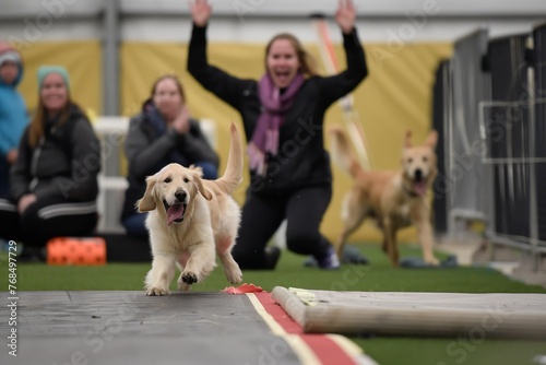woman cheering as a golden retriever finishes the lap