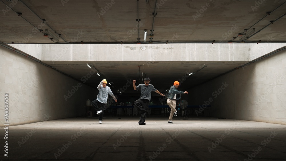 Panorama shot of hipster group dance together while perform b-boy dance. Street dancer team moving to hip hop music while doing freeze pose. Break dance, street dance. Outdoor sport 2024. Sprightly. - obrazy, fototapety, plakaty 
