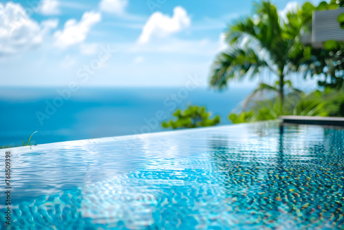 A luxurious infinity pool overlooking a tropical ocean panorama.