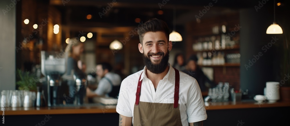 A bearded man in a uniform is standing in front of a bar, possibly ready to greet customers or serve drinks. There is a sense of hospitality and service in the atmosphere.