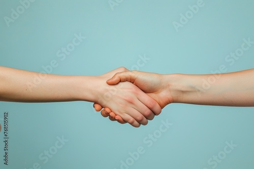 Successful caucasian businessmen shaking hands during a meeting on beige background.