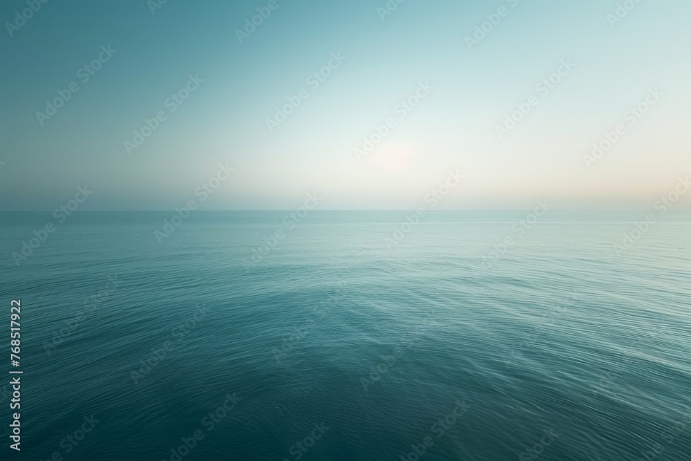 Obraz premium Tranquil sea view at dawn, focusing on the play of light on the water's surface, with a minimalist approach to convey a sense of calm and serenity