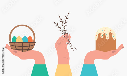 Set of Easter elements. A human hand holds Kulich, a basket with Easter eggs, willow branches.