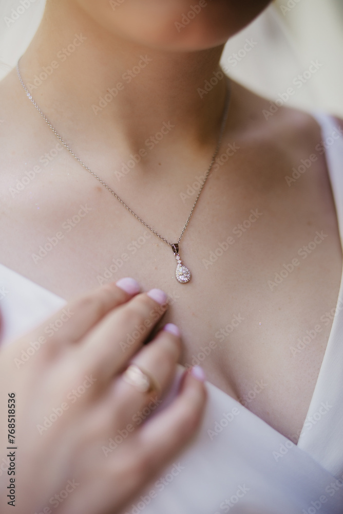 A pendant on a woman's neck