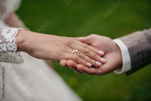 Hand in hand. Certification and marriage proposal. Gentle manicure on beautiful hands