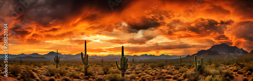 Panoramic photo of an epic sunset in the Arizona desert with cacti and mountains, orange sky with dark storm clouds 