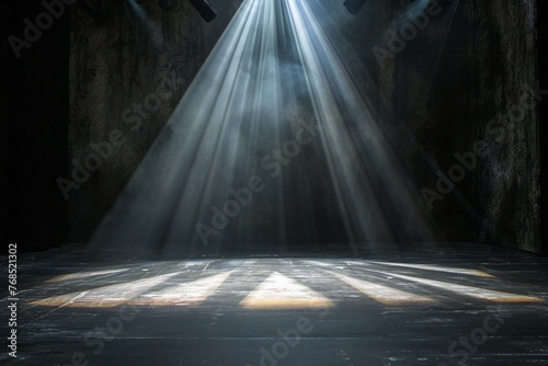 Stage lighting effect in a dark room with concrete floor and spotlight